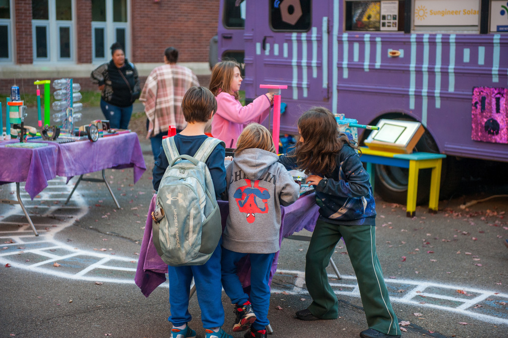 Students working at stations at BJM's STEAM night 