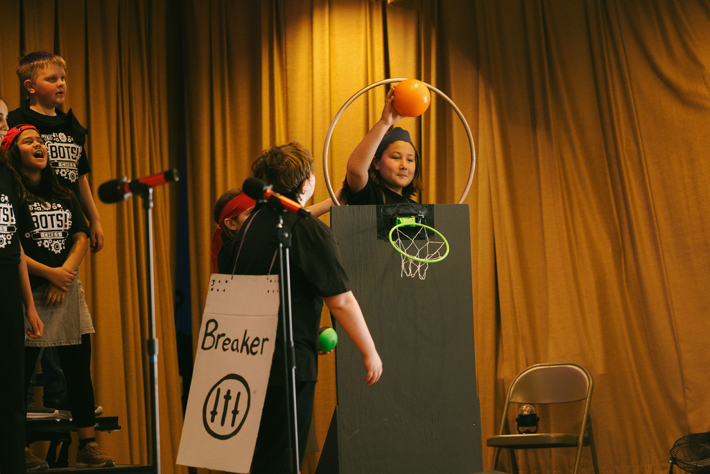 Cayuga Heights fifth graders on stage performing in the musical BOTS!