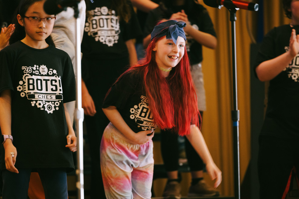 Cayuga Heights fifth graders on stage performing in the musical BOTS!