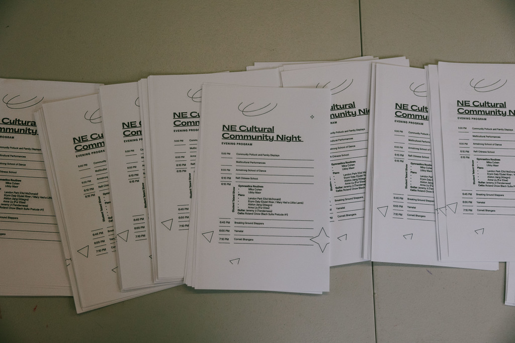 NE Cultural Community Night programs spread across the table