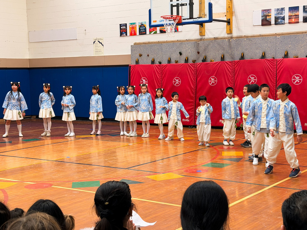 A group of northeast students in the gym performing