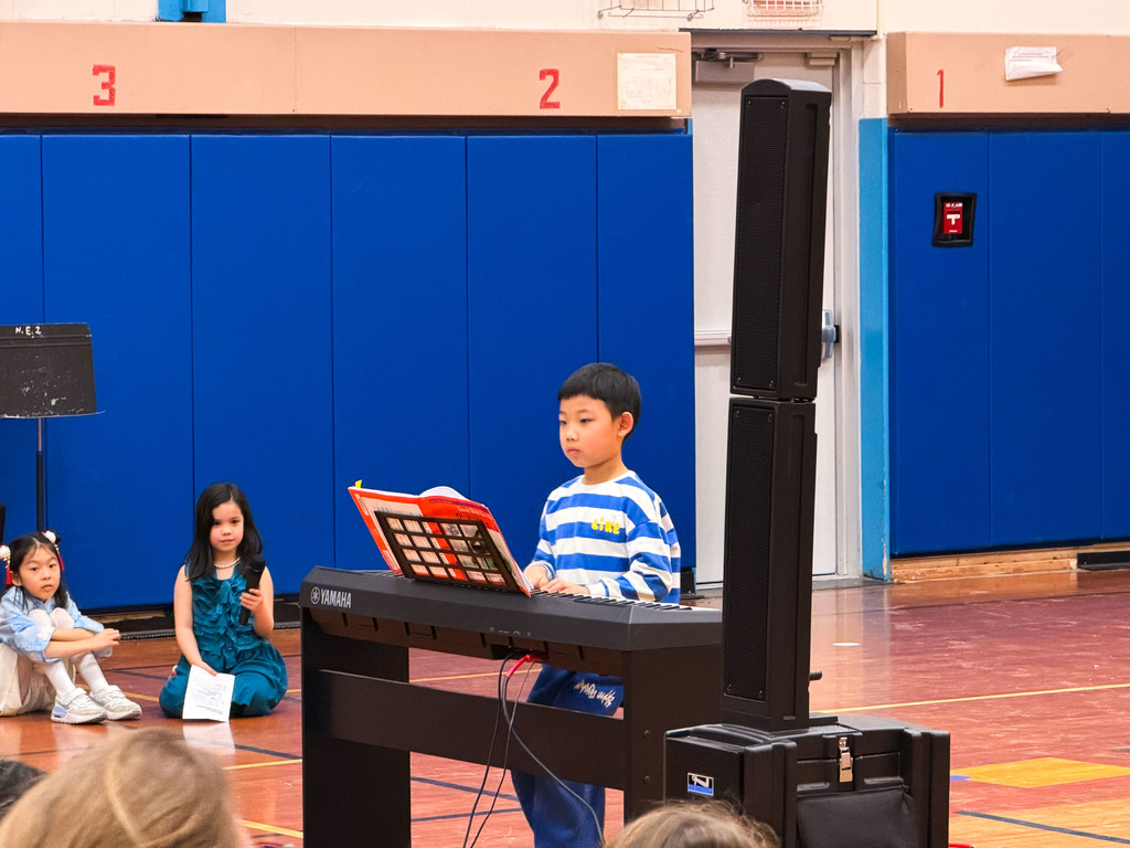 Student in the gym playing the piano