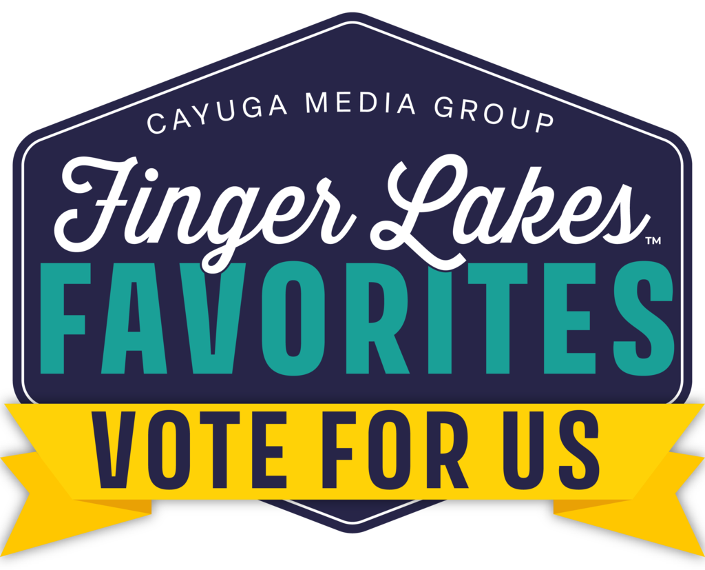 A logo with blue, green, and yellow text on a black background. It reads "Finger Lakes Favorites Vote for Us" with "Cayuga Media Group" below.