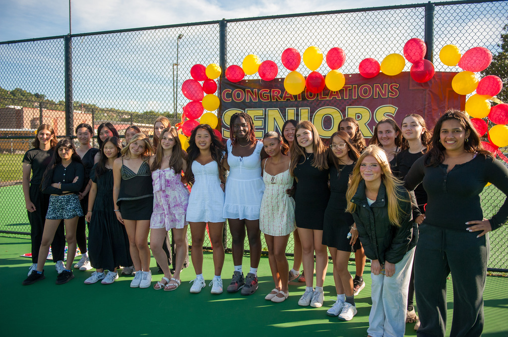 The girls tennis team poses for a photo