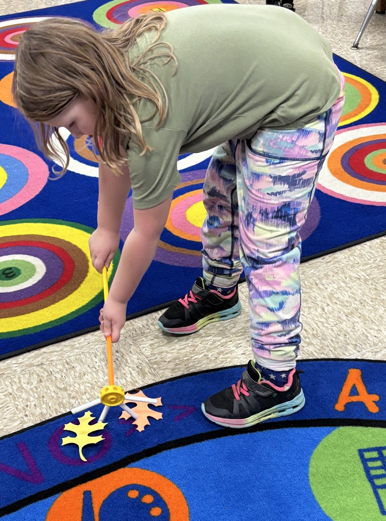 student with rakes