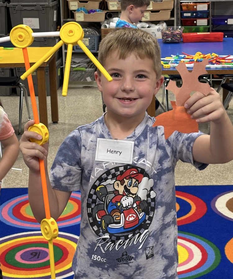 student with rake