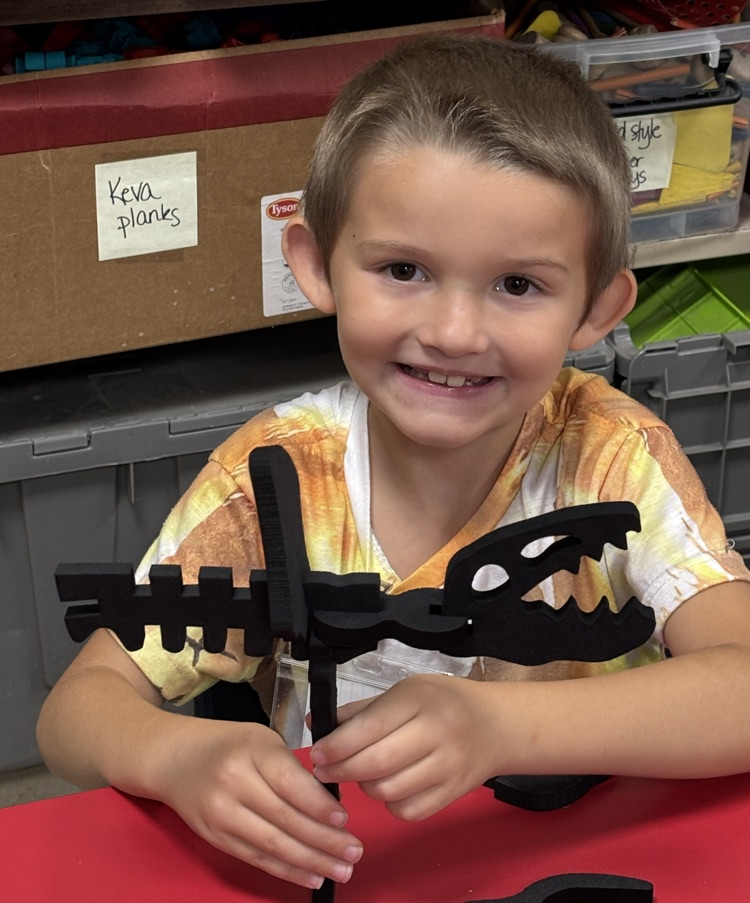 student with dinosaur