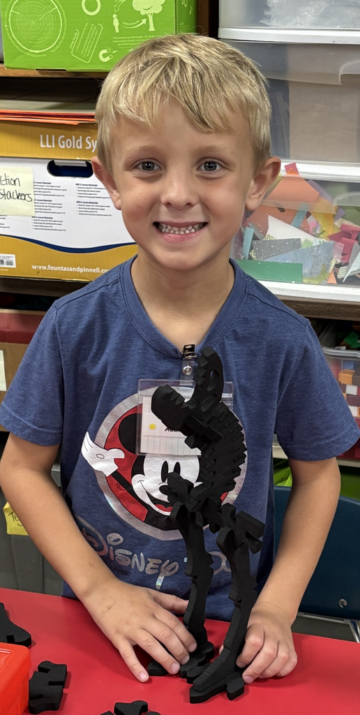 student with dinosaur