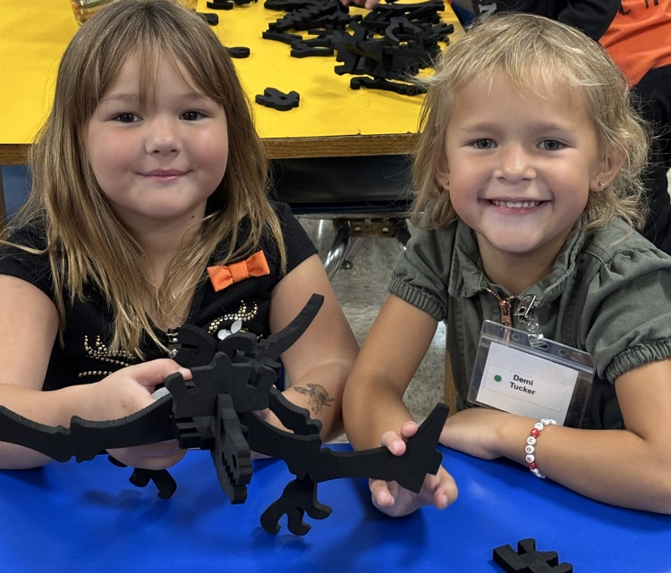 student with dinosaur