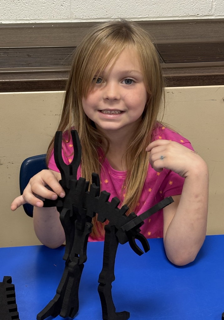 student with dinosaur