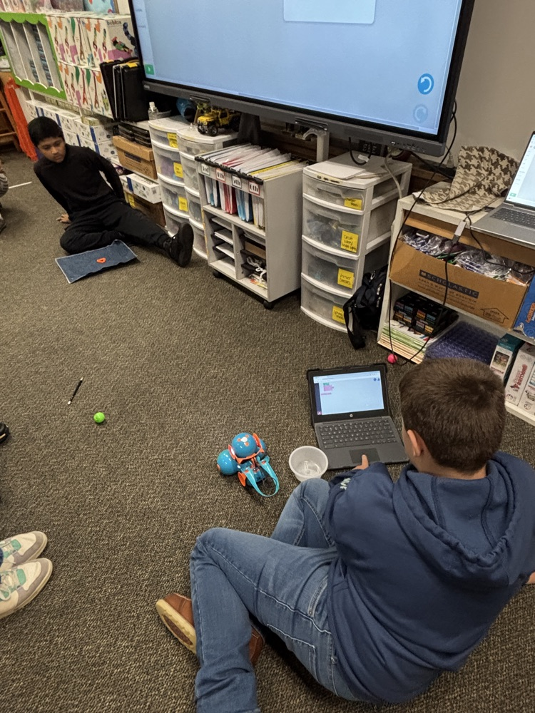 students with dash robots