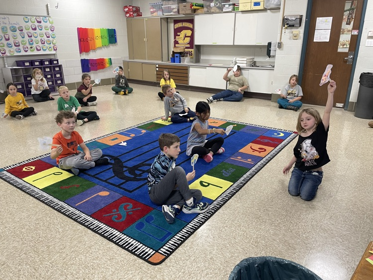 students sitting with fish