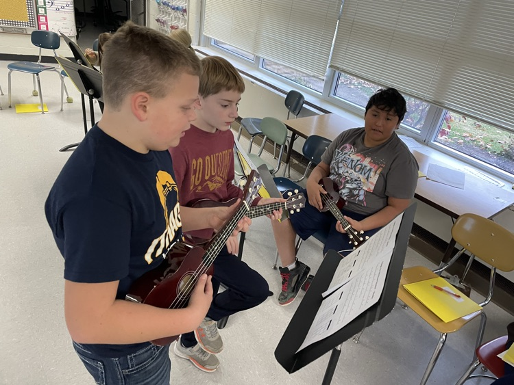 students playing ukulele