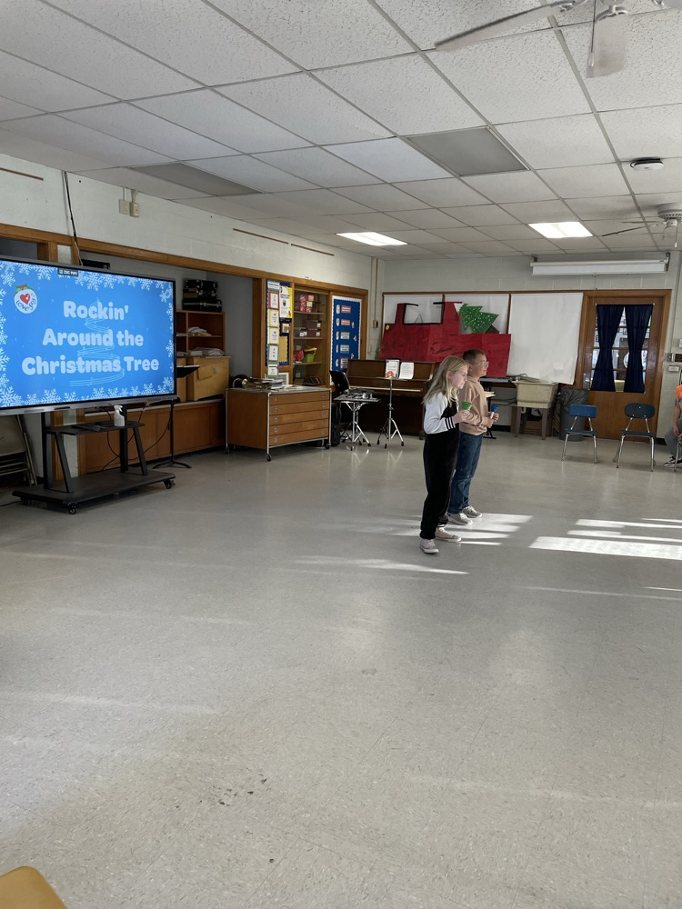 students standing in front a of a screen