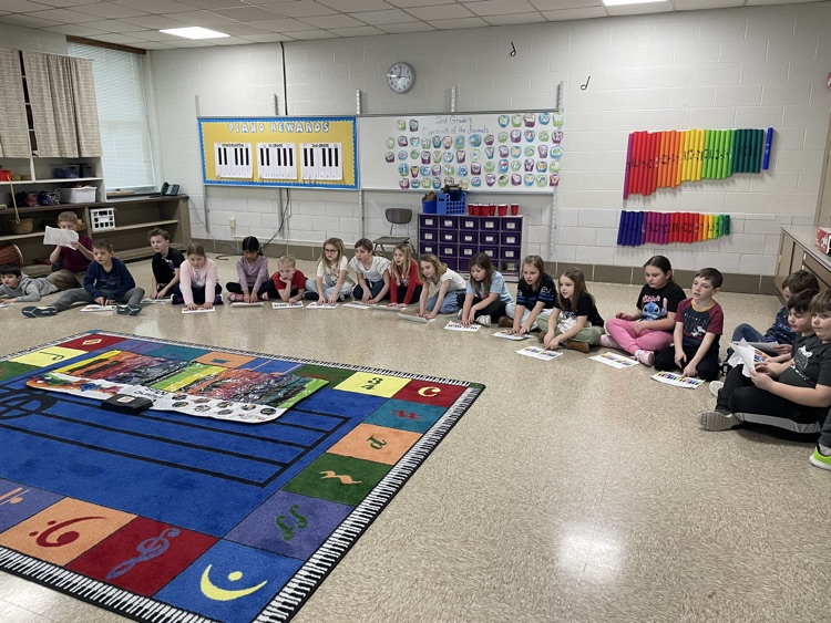 students playing pianos