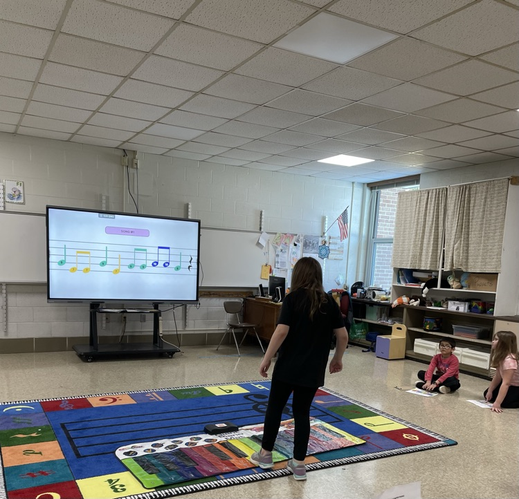 students playing pianos
