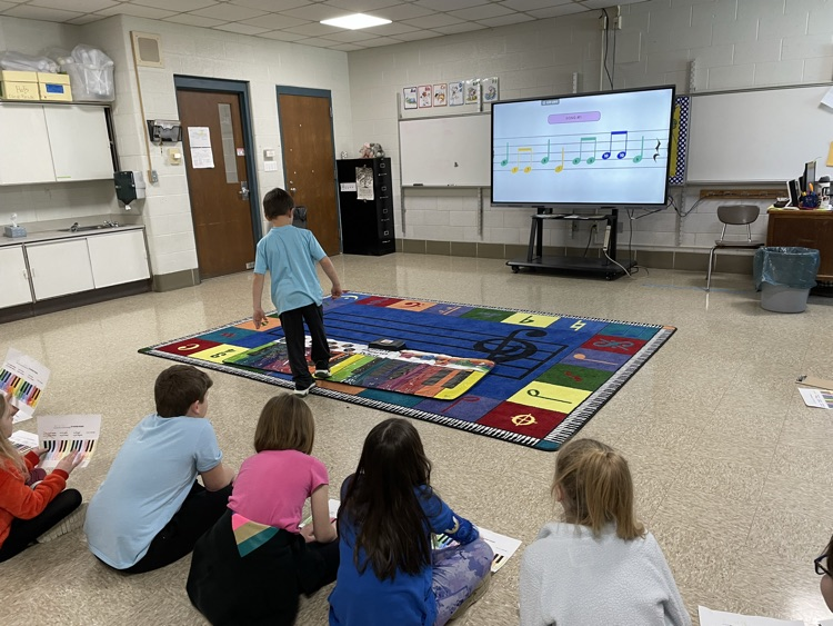 students playing pianos