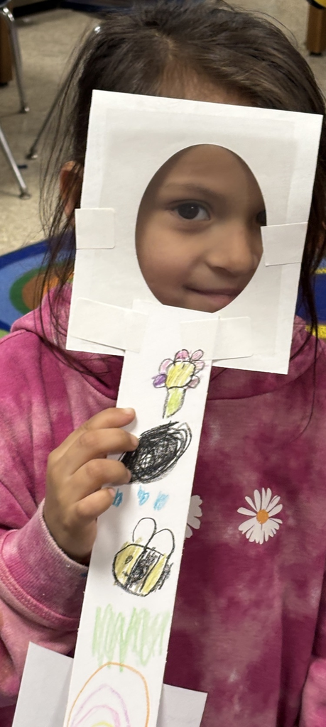 student with magnifying lens