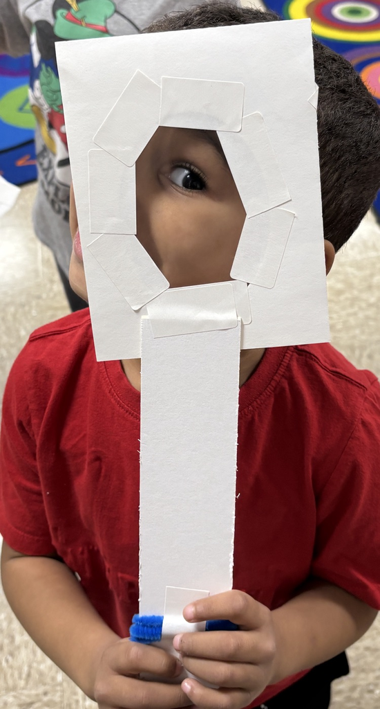 student with magnifying lens