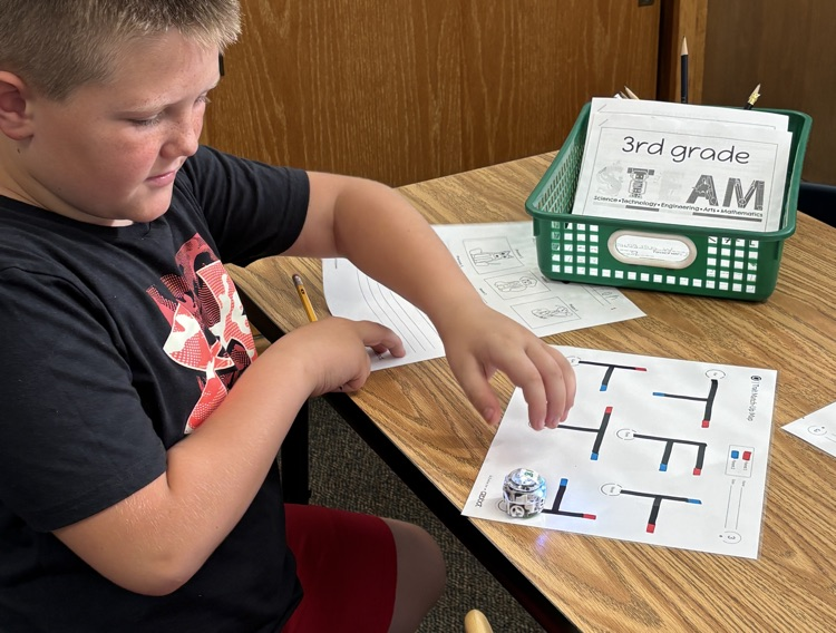 student with robot 