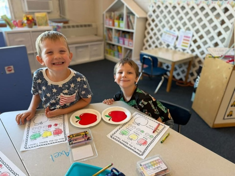 students with Apple craft