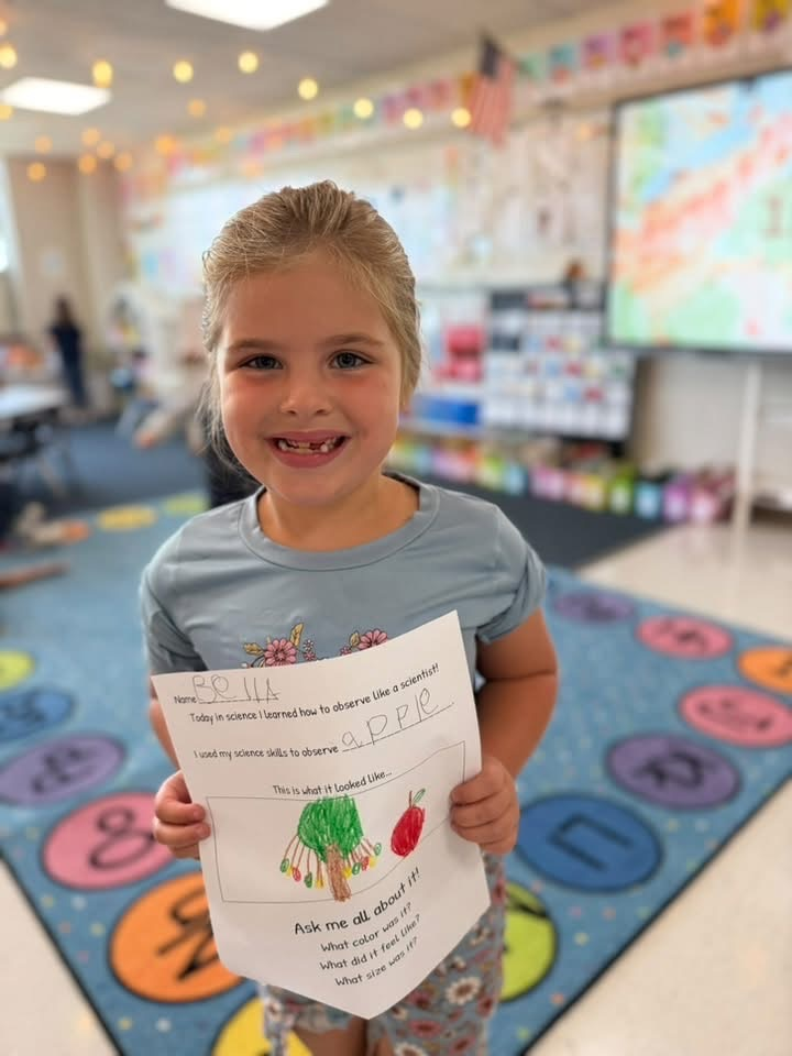 student with Apple worksheet 