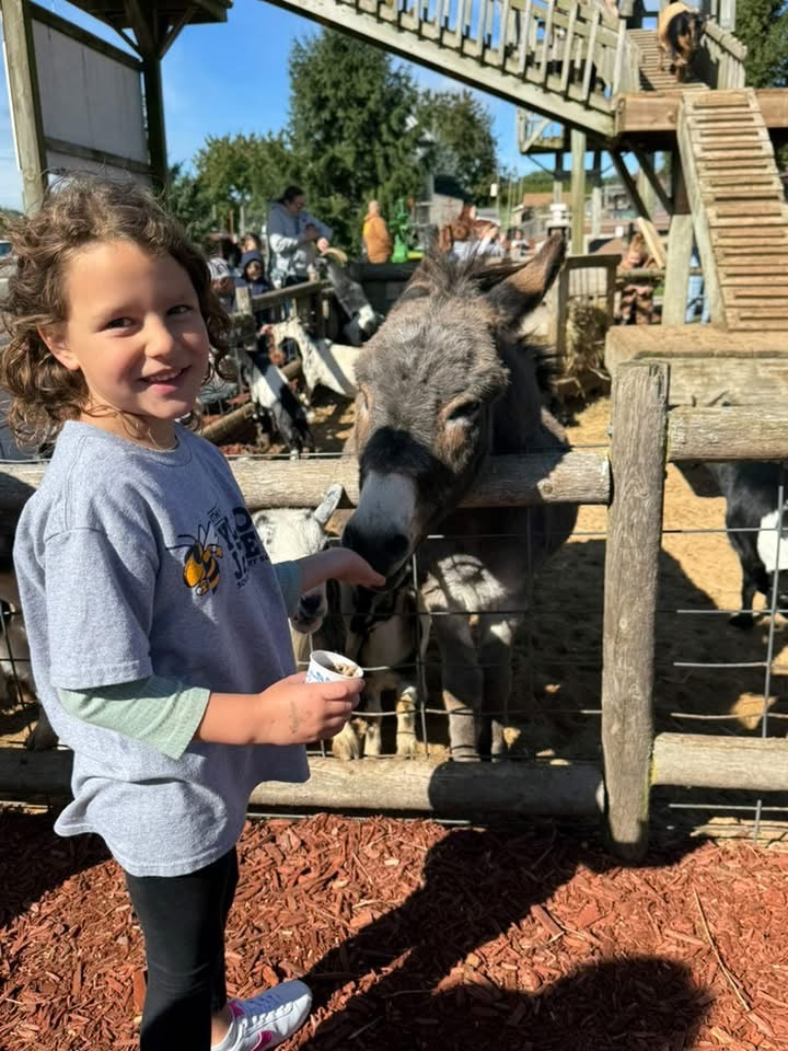 student with a donkey