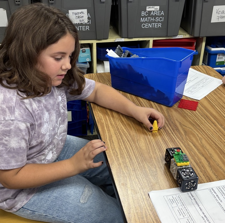student with plant model 