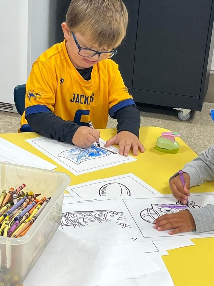 students coloring pictures