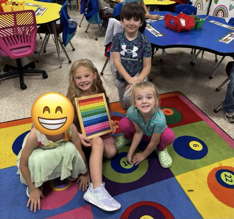 students holding a puzzle