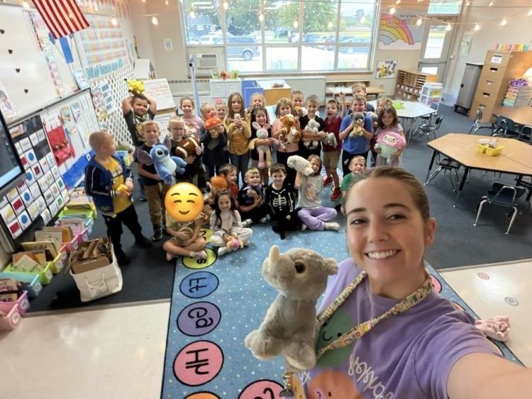 teacher with students and their stuffies