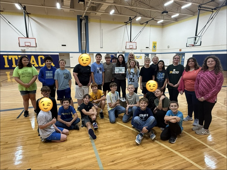 students around the teacher of the week