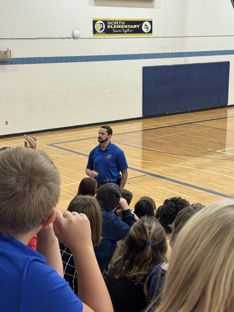 officer Greene presenting to 5th grade students in gym 