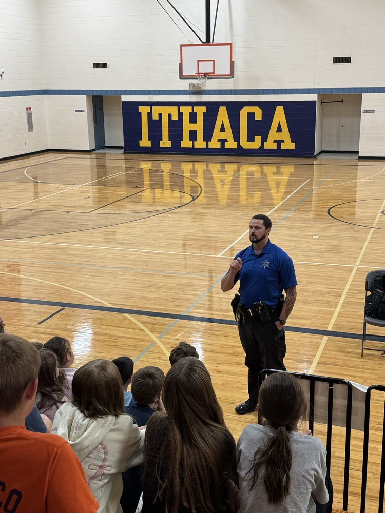 officer Greene presenting to 5th grade students in gym 