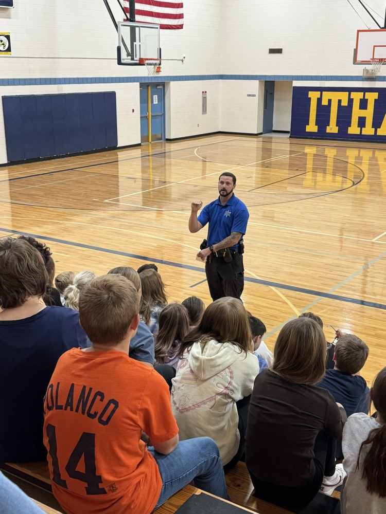officer Greene presenting to 5th grade students in gym 
