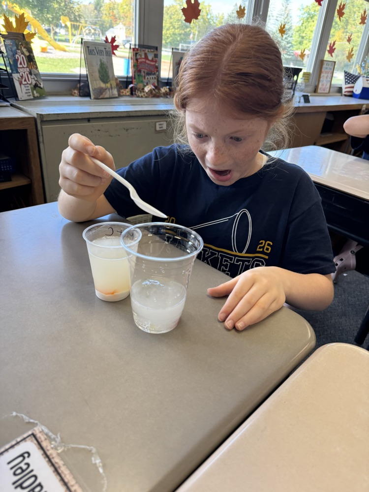 student having reaction to science experiment 