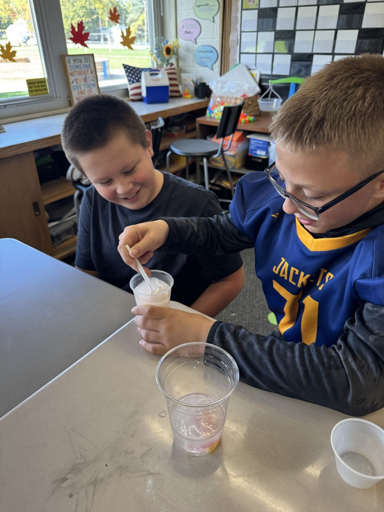 students working on science experiment 