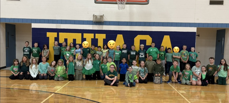 3rd grade students dressed in their class color of green