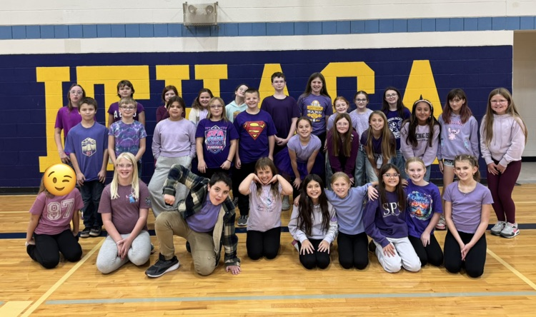 5th grade students dressed in their class color of purple