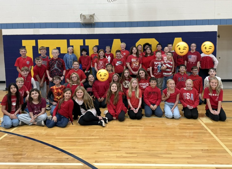 6th grade students dressed in their class color of red