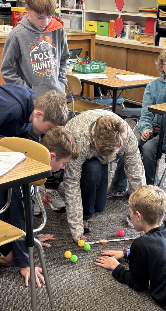 teams measuring bocce ball distances