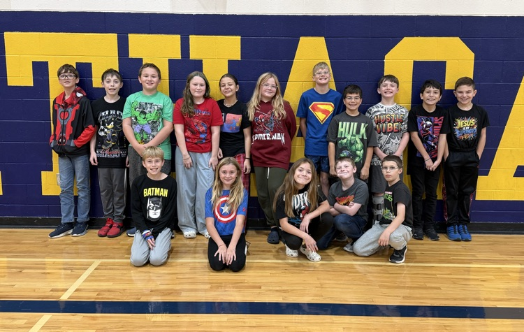 Sixth grade students dressed up with their superhero graphic t-shirts 