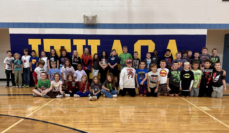 Students from North Elementary all dressed up in superhero graphic t-shirts 