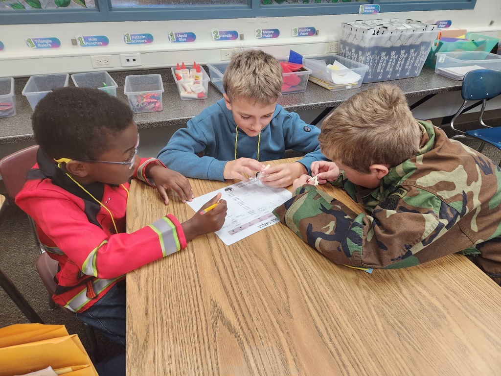 4th graders studying skulls of animals.....