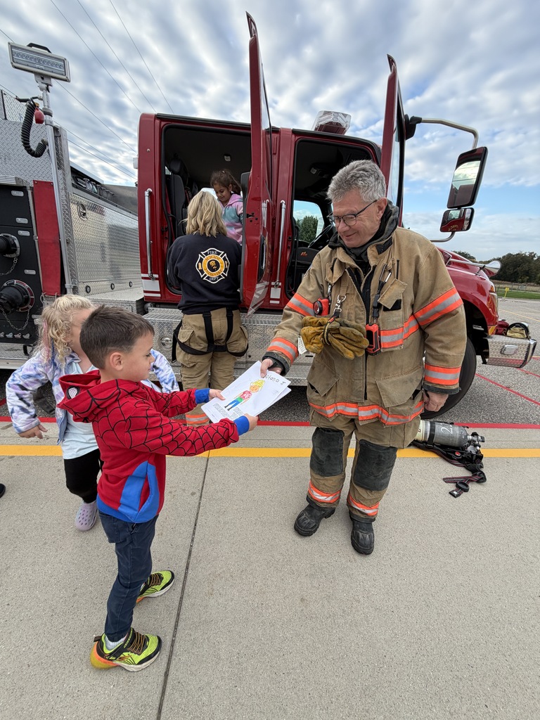Students with a firefighter.