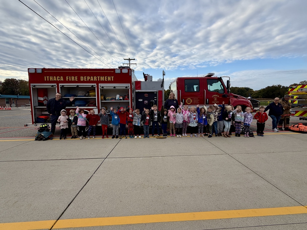 Students standing in front of a firetruck.