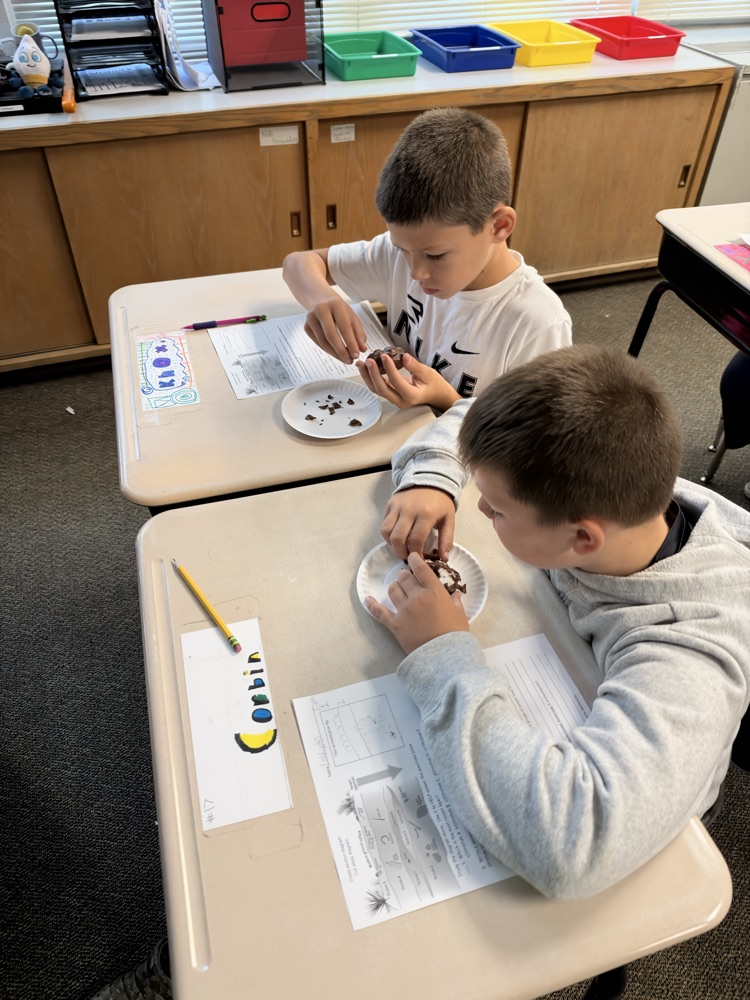5th graders using a cookie to compare to the geosphere 
