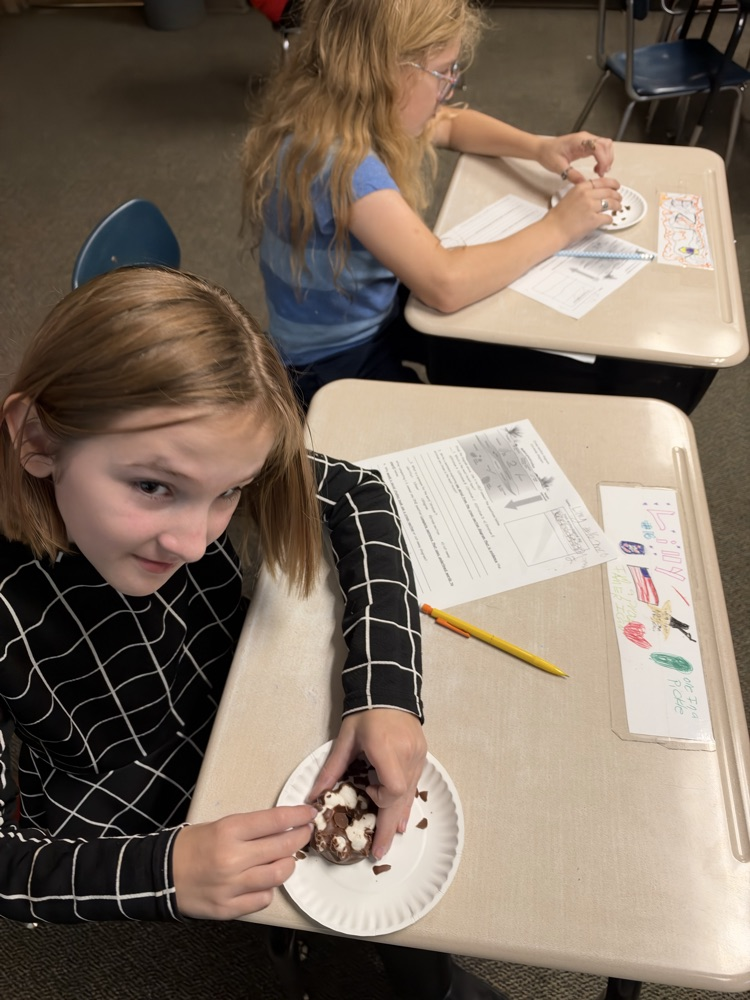 5th graders using a cookie to compare to the geosphere 