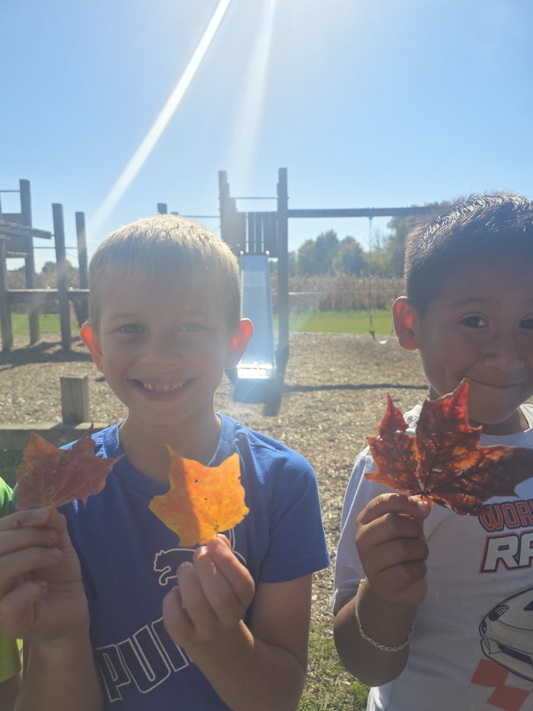 Students holding leaves.