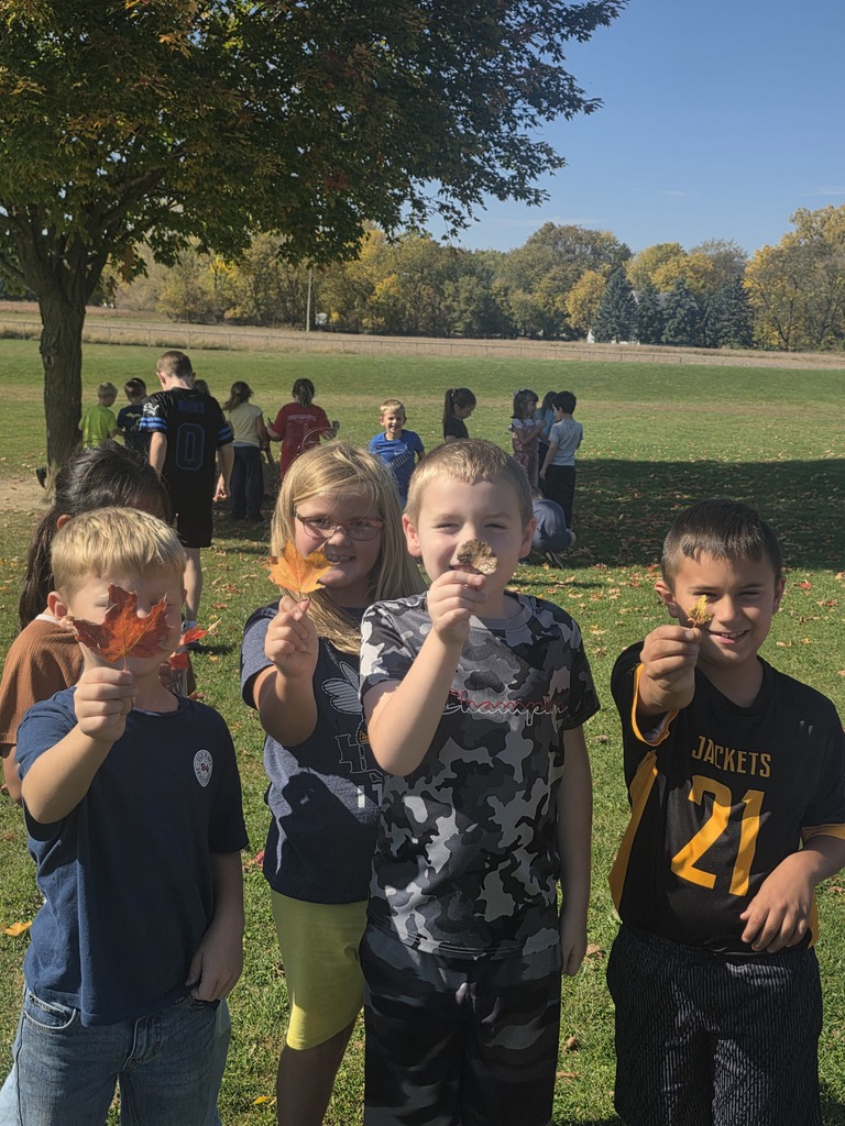 Students holding leaves.